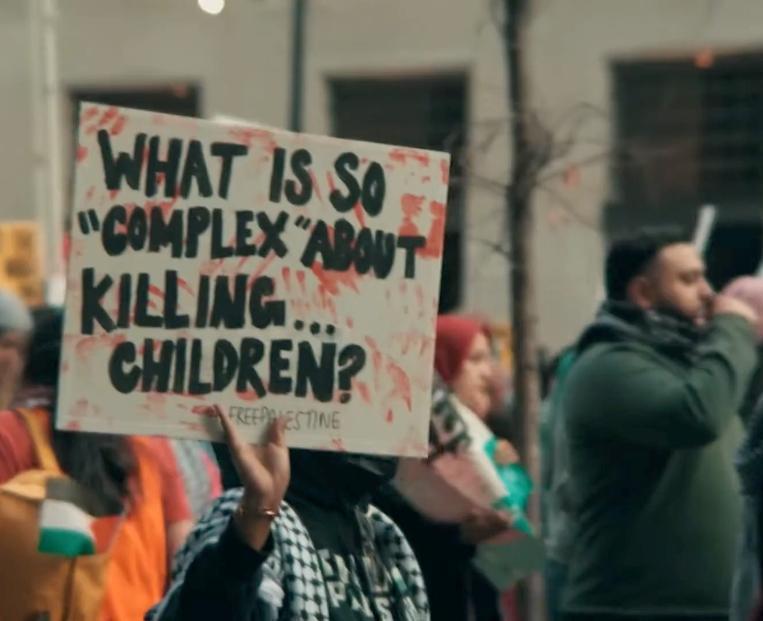protest-sign-about-murdering-kids.jpg